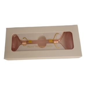 Rose colored Facial RolIer Face Massager. NEW in original box